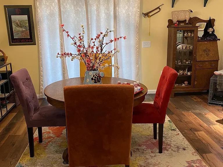 Nice dining area, convenient to the kitchen, open the curtains and enjoy the patio.