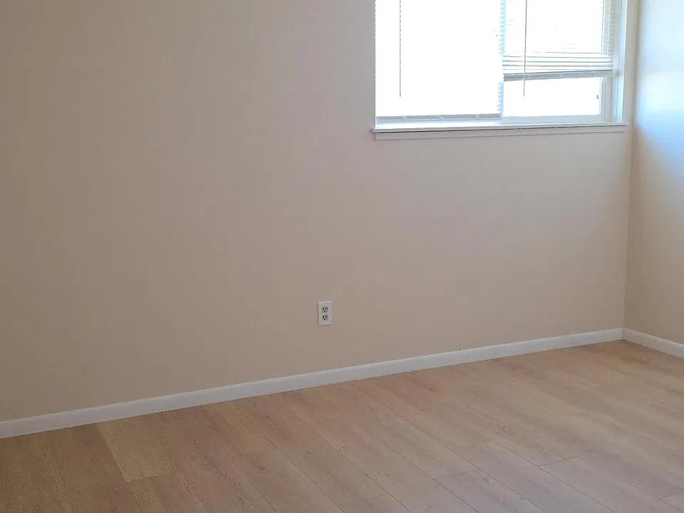 new laminate flooring throughout main living area and bedroom