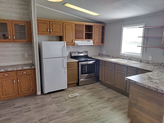 Kitchen with new countertops and lower cabinets.