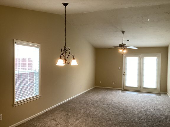 Large living area with French doors leading out to your back private area courtyard.