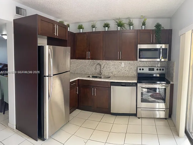 560 NW 82nd Pl #305 — Photo 3