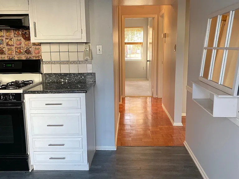 Kitchen and Hallway to bedrooms and bathroom