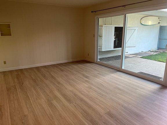 Living room with sliding glass door to yard