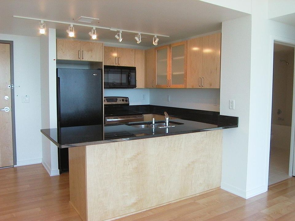 Kitchen open to Dining and Living Room