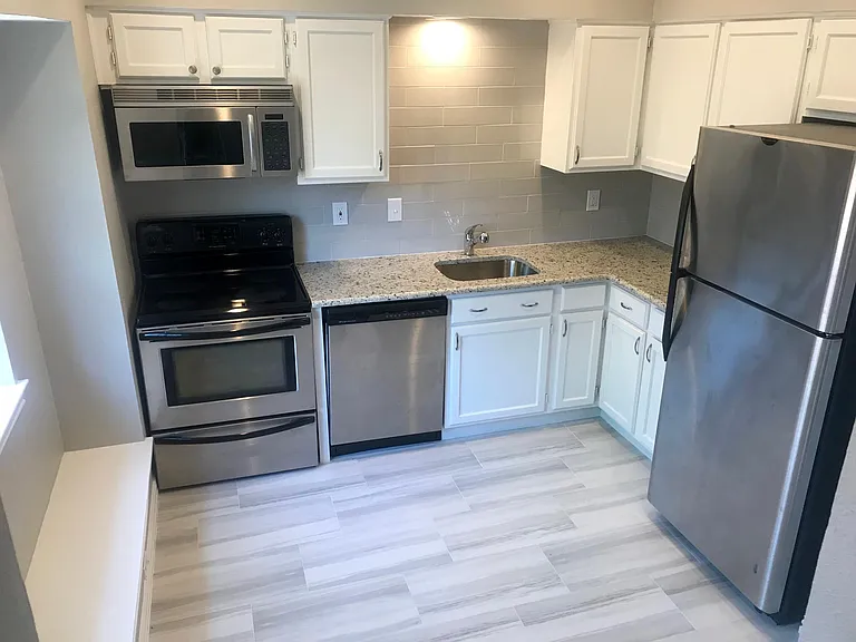 lots of deep, built in cabinet for storage, as well as a full size pantry next to the fridge!