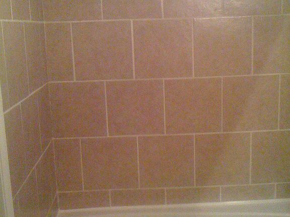 master bathroom with whirlpool tub and tile