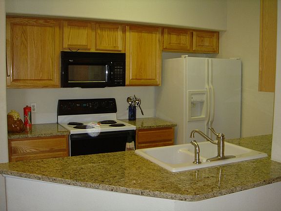 Kitchen with new slab granite counters