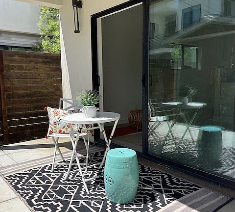 The living room has a slider that will open out to a private concrete patio that is approx 120 sq feet.