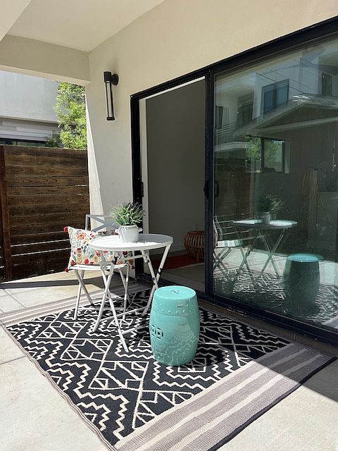 The living room has a slider that will open out to a private concrete patio that is approx 120 sq feet.