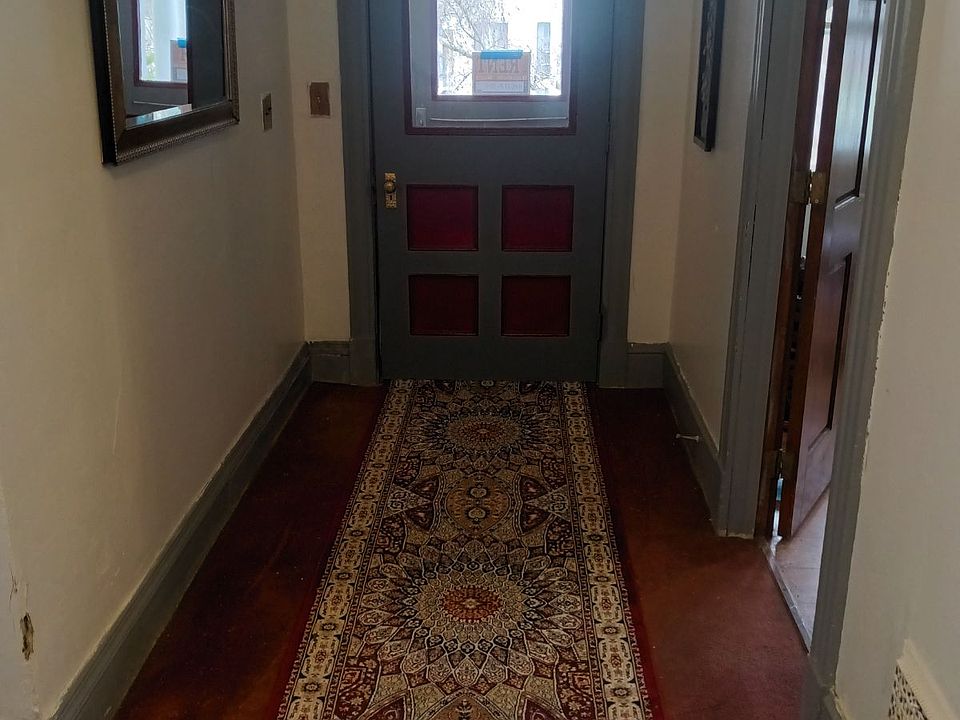 Front hallway, door open to this rental