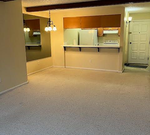 From living room towards dining area and kitchen.