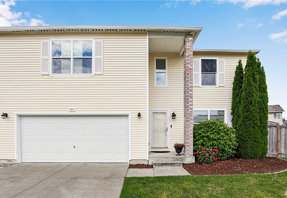 Welcome home to this roomy abode with low maintenance landscapes & cozy comforts