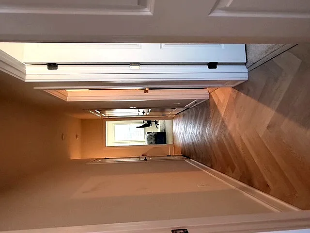 Upper level hallway where washer dryer presents