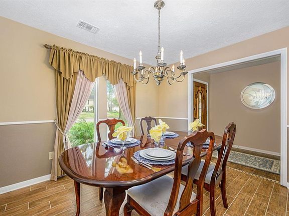 The formal dining room is off the entrance foyer. This room is tastefully decorated and ideal for entertaining.