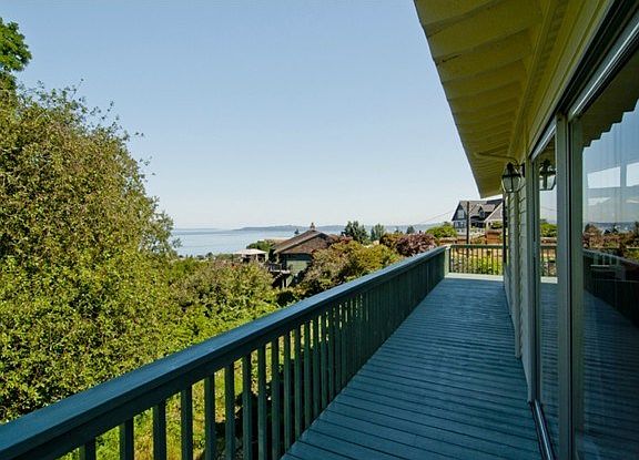 Views of the Sound and Olympics from the side deck. Adjacent and