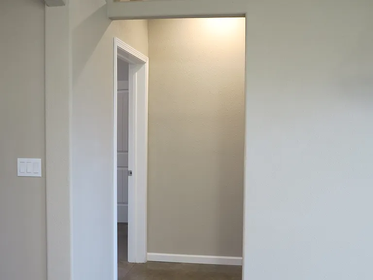 Hallway to the bathroom and the bedroom.