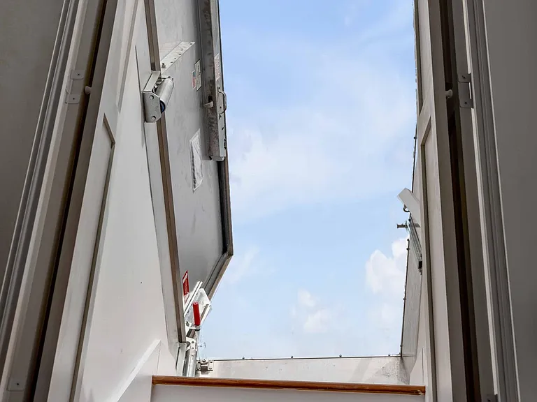 Door to rooftop terrace, at top of landing to fourth floor guest bedroom.