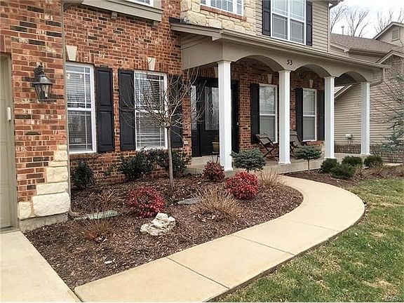 Professional landscaping highlights the sidewalk entry to your new home, and there's still plenty of