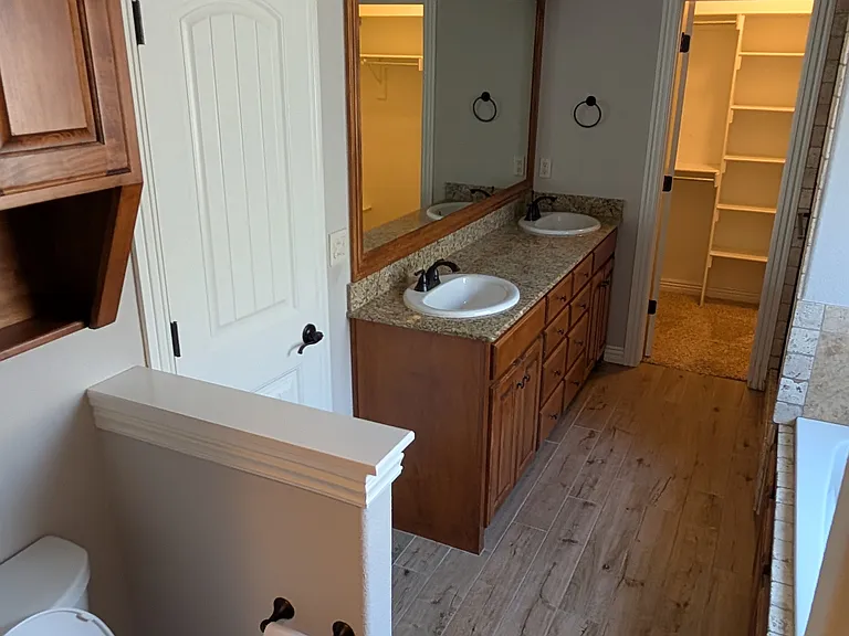 Master Bathroom with double vanity and 2 walk-in closets. Walking Closet #2.