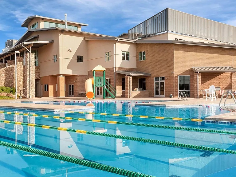 At Meridian Ranch's own 42,000-square-foot rec center you can choose from a full array of activities, classes and fitness opportunities. Children love the year-round indoor pool with water slide and interactive play features.
