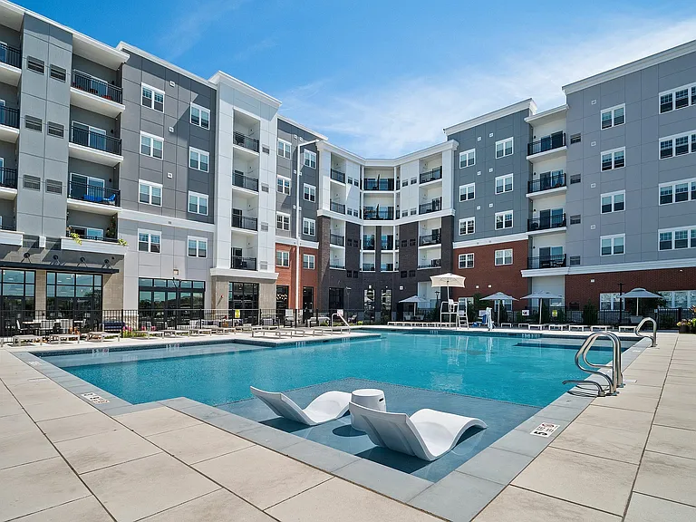 Experience upscale living with this stunning poolside view, offering relaxation and style.