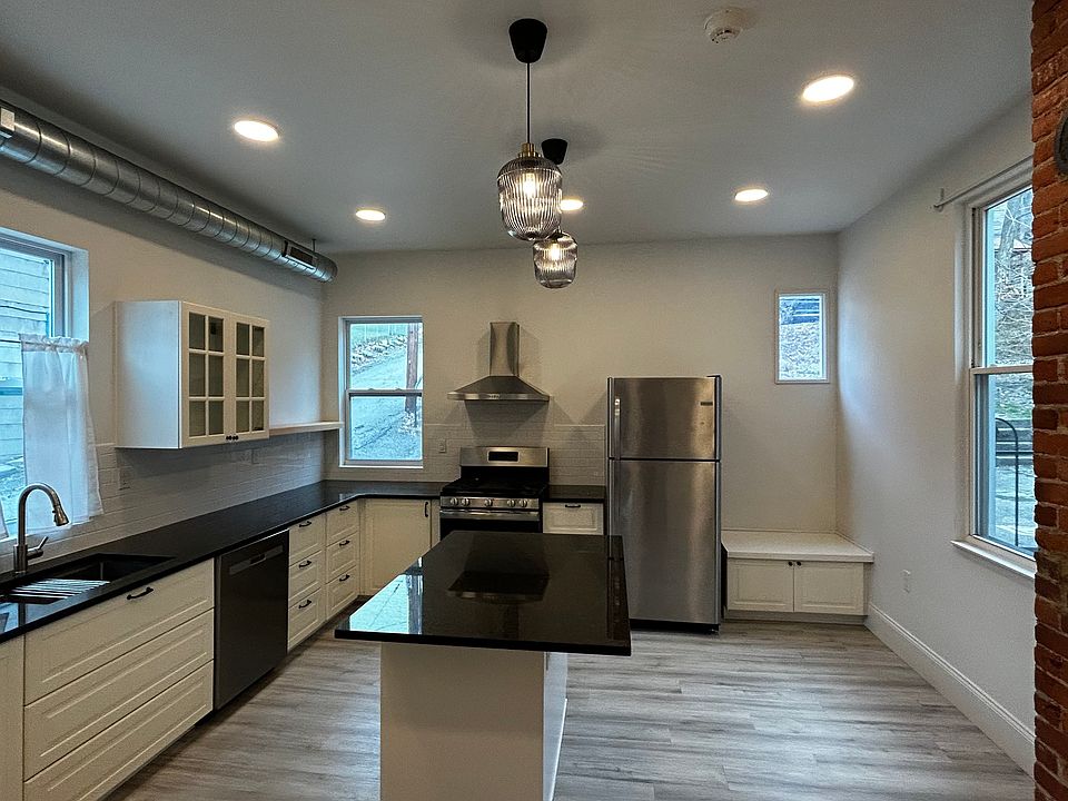 Windows on three sides of this huge Kitchen