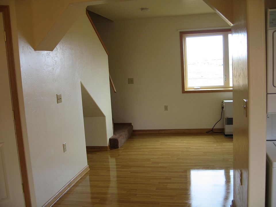 Living room and upstairs from kitchen