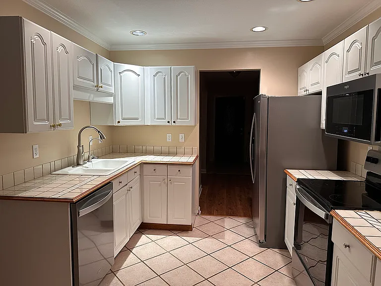 New dishwasher, refrigerator, stove, and microwave.