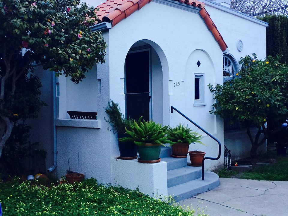 Front of house. Note Spanish tile.
