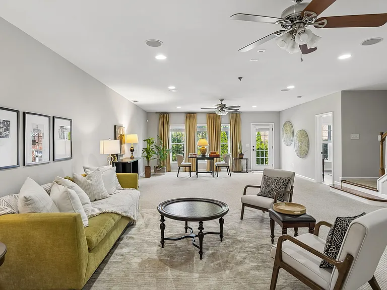 Filled with natural light from numerous large windows and direct outdoor access, the space feels bright, open, and connected to the beautifully landscaped yard. (and has ~585sqft of additional UNFINISHED SPACE)