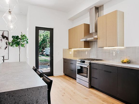 large oversized kitchen and small patio off kitchen