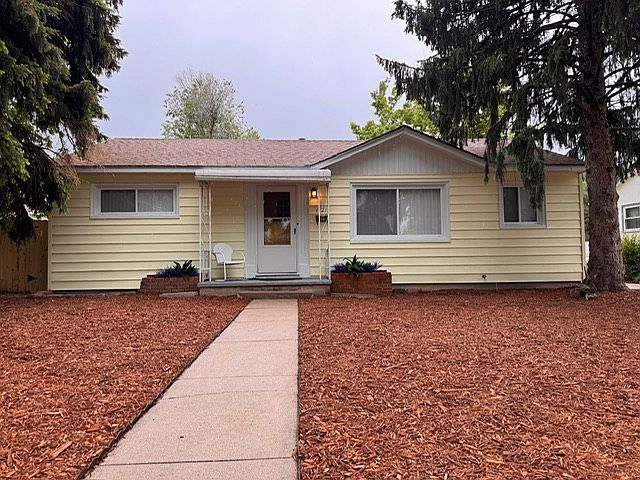 Front of house. Siding has been power washed and mulch has been replaced.