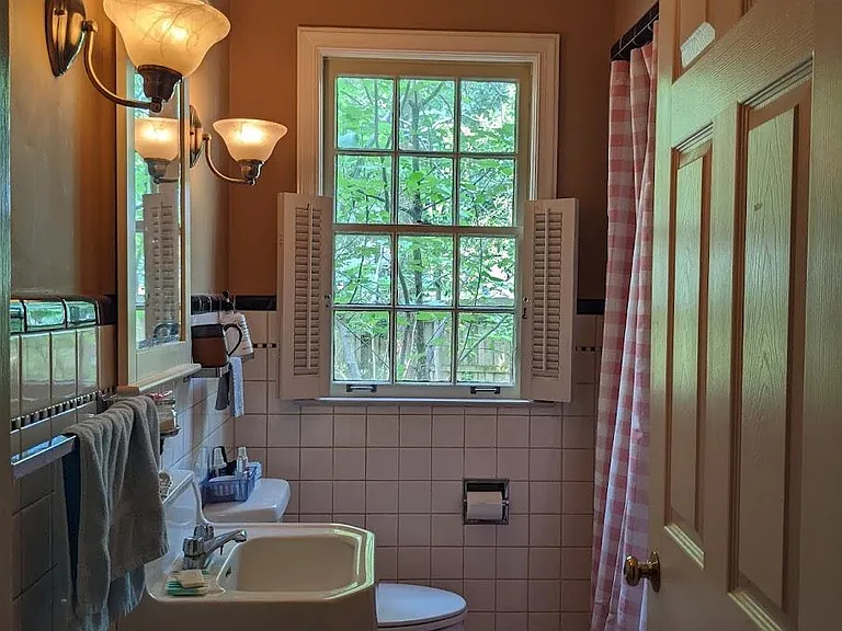 Original Classic Downstairs - (Full Bath). Window looks out over private , lower patio.