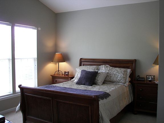 First floor master bedroom with vaulted ceilings and walk in closet