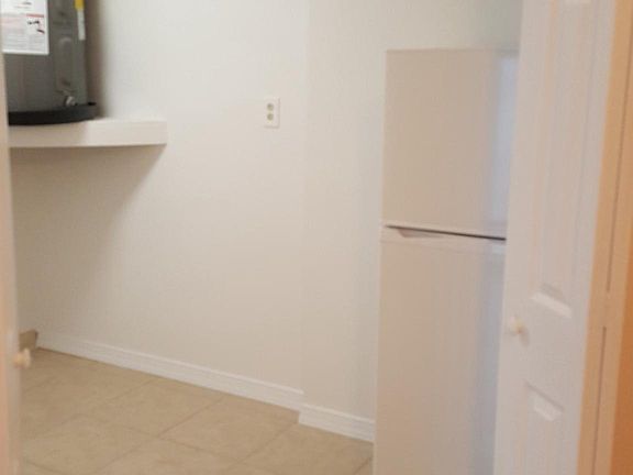 new laundry room and backup/extra fridge