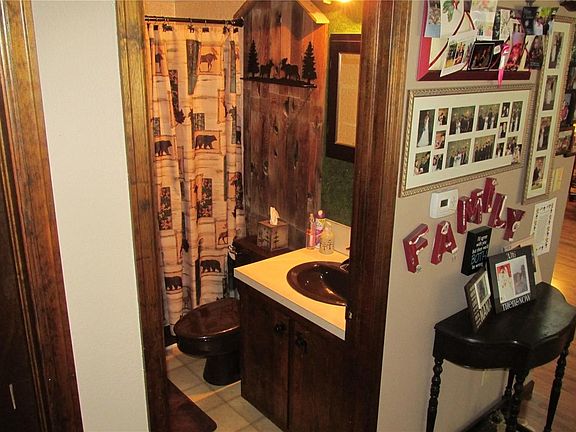 Main full bath has a "rustic" feel. Custom paint throughout