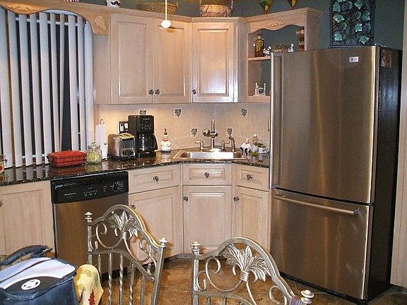 Custom Granite Kitchen with S/S Appl. Mud floors and Ceramic Tile