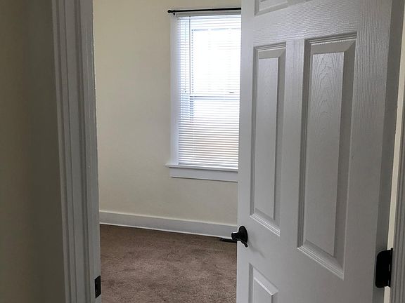 One of two upstairs bedrooms, will have refinished wood floors. New paint, blinds, door in 2017