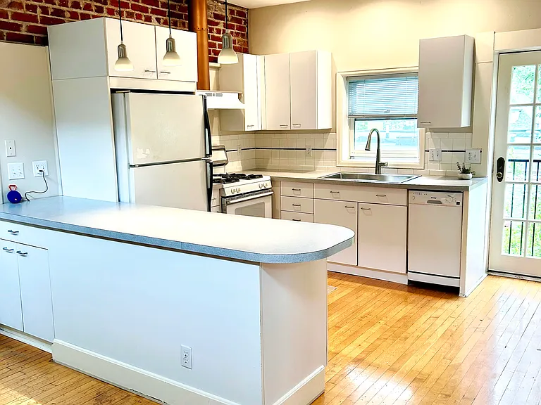 Kitchen with a view of one of the Juliet balconies.