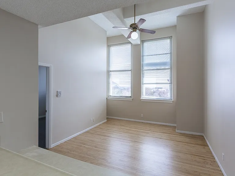Two large windows and high ceilings at Rosewater.