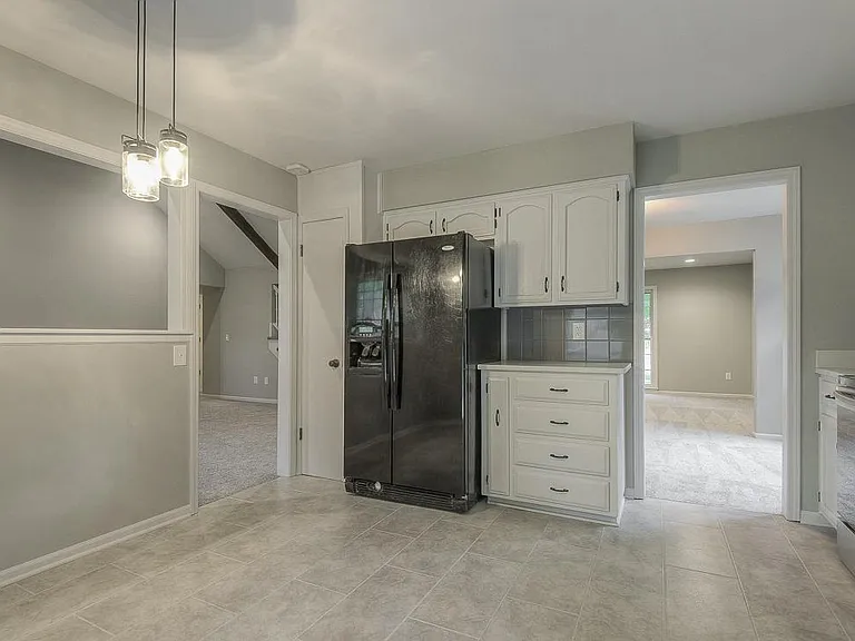 Kitchen has central access to the family room, the dining area, and the outside deck space.