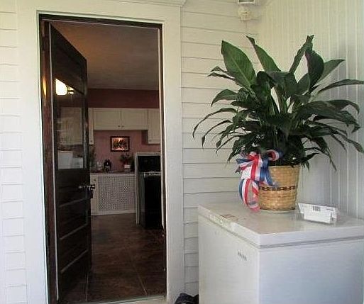 Welcome home!  Coming in through the back screened-in porch, to the kitchen