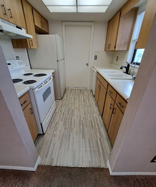 Ktichen goes out to garage / laundry. Includes disposal and dishwasher