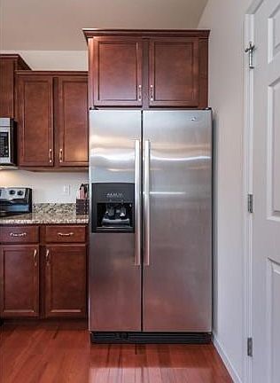 Notice the cabinetry crowing the refrigerator area.