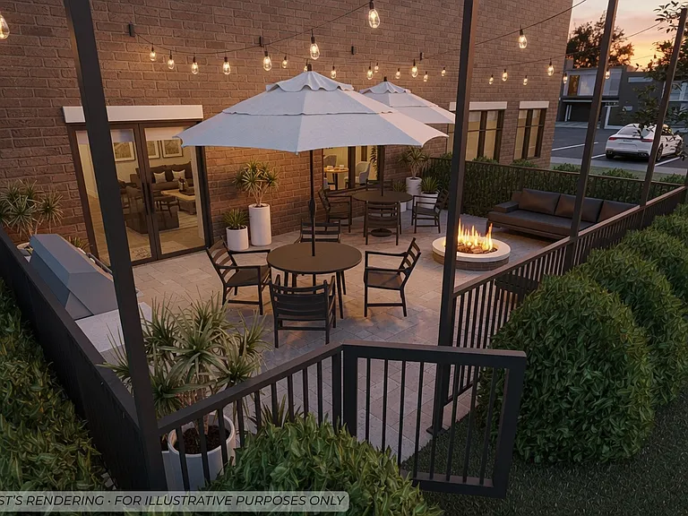 Outdoor community patio with dining, lounge seating, and fire pit