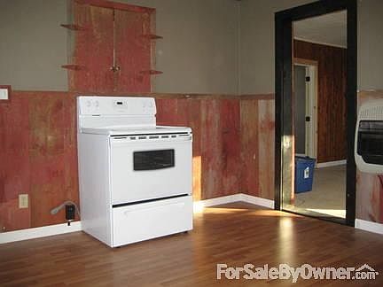 One view of kitchen
						:
						Rustic barn wood and a neutral color makes this kitchen cozy!