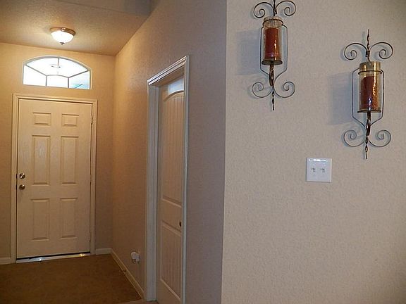    Front entry shows off door to laundry room