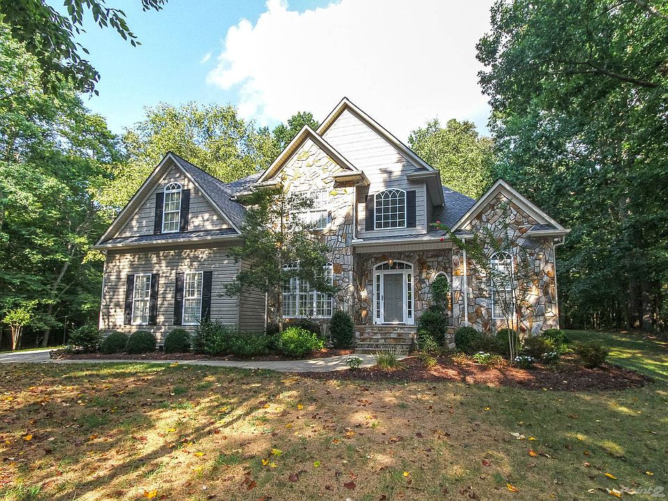 Stately home with wooded acre+ lot