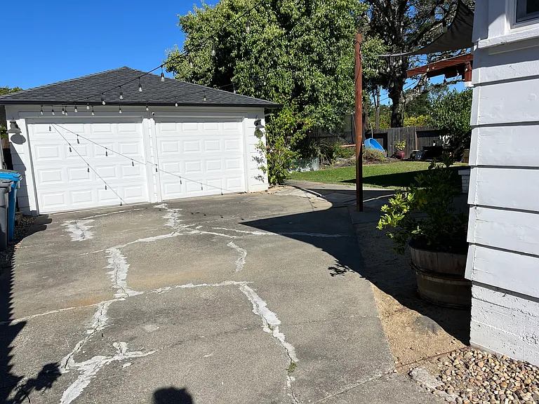 Double Garage behind fenced driveway