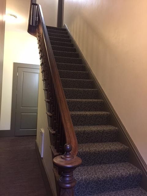 Apartment entrance is at the top of the stairs on the right
